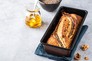 Banana bread on light concrete background. Copy space.