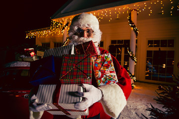 Merry Christmas and Happy Holiday! Santa Claus presents gifts.