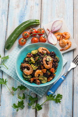 black rice with shrimp zucchinis and tomato