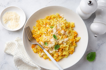 Pumpkin risotto in white bowl