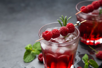 raspberry cocktail with ice and fresh berry