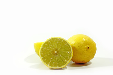 Juicy lemon slice on white background.