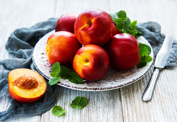 Plate with fresh nectarines