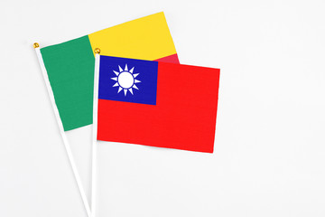Taiwan and Benin stick flags on white background. High quality fabric, miniature national flag....