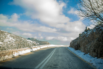 Mountain Road with snow and clouds at Parnitha, Greece