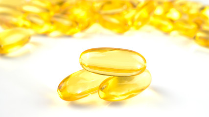 Fish oil capsules with omega 3 and vitamin D isolated on white background,varies benefits supplement and support heart health,healthy diet concept, selective focus