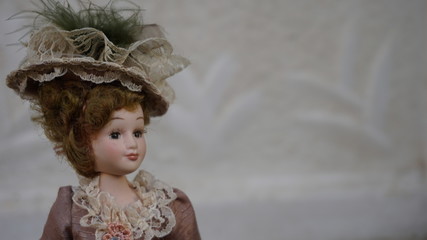 A vintage doll with classic dress