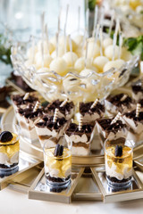 Festive table for newlyweds and guests. Dessert table for a wedding party