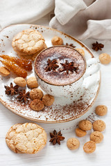 Hot cocoa drink with spices and almond cookies