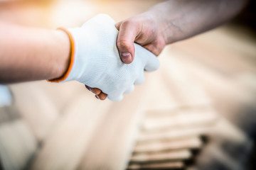 Man hands deal after installing laminated wooden floors, Professional floor work done.