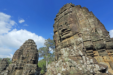 Ancient stone faces of Bayon temple in complex Angkor Wat in Siem Reap, Cambodia 