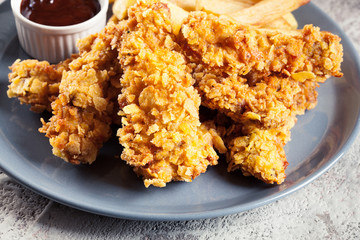 Chicken strips in cornflakes breadcrumb