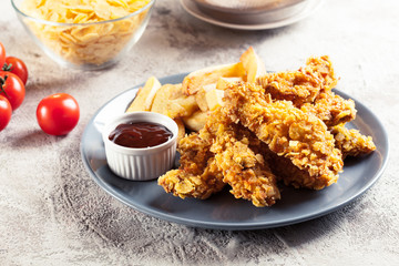 Chicken strips in cornflakes breadcrumb