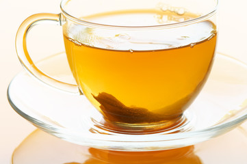 Fresh hot tea in glass cup cllose-up