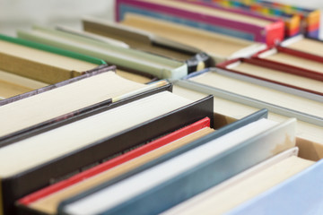Collection of old books for reading and self-education in the library, close-up