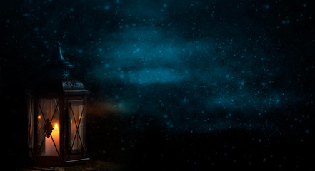 Lantern with candle in front of dark background with snowflakes - 302389486