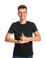 Young deaf mute man using sign language on white background
