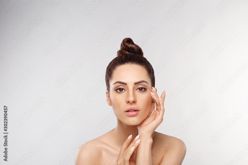 Wall mural beautiful woman portrait, skin care concept, beautiful skin. portrait of female hands with manicure 