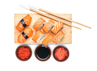 Composition with different sushi on white background