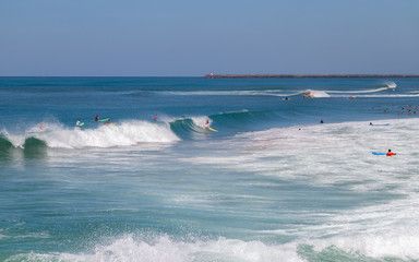 Biarritz, Atlantic ocean, active holidays. Surfers in the ocean.