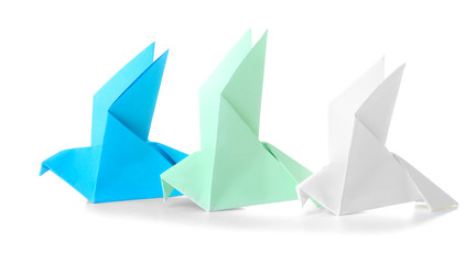 Origami birds on white background