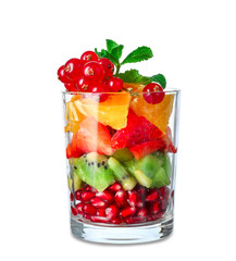 Glass with tasty fruit salad on white background