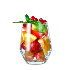 Glass with tasty fruit salad on white background