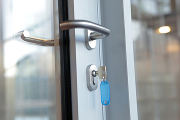 typical key in the lock, office door - close up