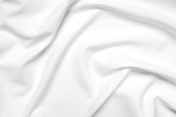 Abstract white fabric texture background. Cloth soft wave. Creases of satin, silk, and cotton.