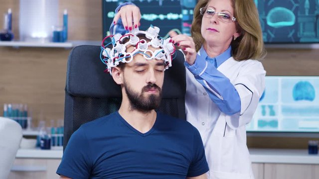 Male patient falling asleep while female doctor
