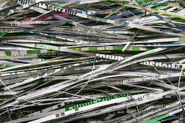 Close up stack of scrap paper from paper cutter for background. Paper recycling to the destroyer....