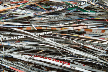 Close up stack of scrap paper from paper cutter for background. Paper recycling to the destroyer....
