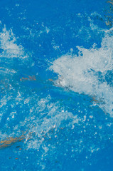 waves and bursts of water in the pool