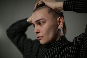 Portrait of a frustrated young man in a semi profile