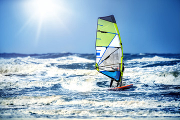 Windsurfing, Fun and action in the ocean water. Extreme sunny sport .