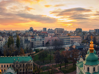 Naklejka premium Aerial view of Kyiv city, St. Sophia Cathedral at sunset, Ukraine. Panoramic cityscape