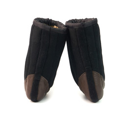 Russian traditional winter black boots-burki isolated on white background. Warm shoes for the elderly