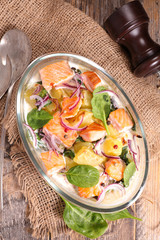 salmon fillet cooked with cream, vegetable and onion
