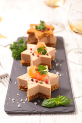 festive canape with gingerbread cake, foie gras and salmon