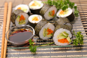 maki with soy sauce and chopsticks