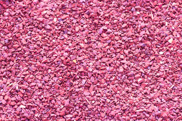 Pebbles, small pebbles, granite marble chips, texturedcoating of footpaths. Building material stone crumb pink, background backdrop texture