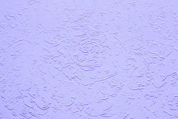 Purple lilac stucco, wall decoration, background backdrop texture. Wall surface with colored plaster coating. Rough wall surface