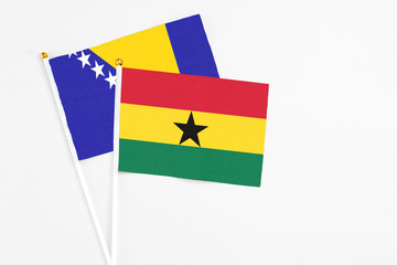 Ghana and Bosnia Herzegovina stick flags on white background. High quality fabric, miniature...