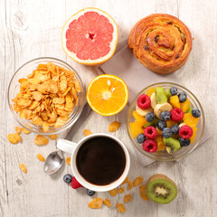 coffee cup, cornflakes and mixed fruit