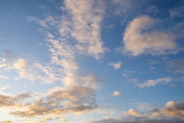 blue sky with white clouds at sunrise