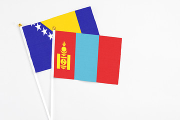 Mongolia and Bosnia Herzegovina stick flags on white background. High quality fabric, miniature national flag. Peaceful global concept.White floor for copy space.