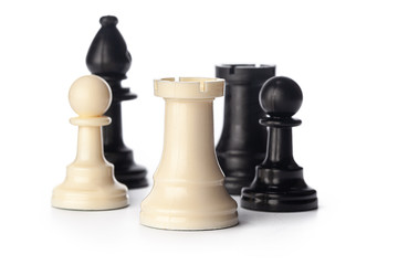 Black and white chess pieces on white background