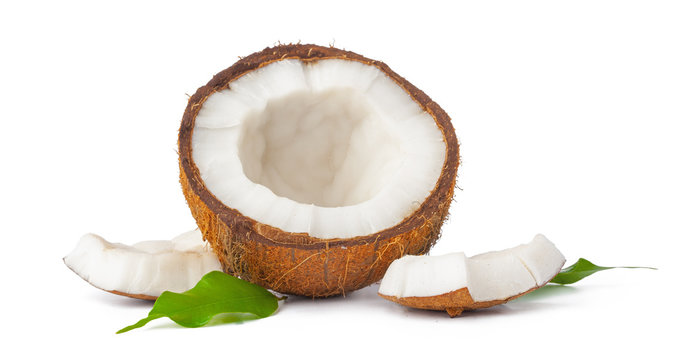 Cracked coconut with leaves isolated on white background