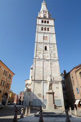The Ghirlandina is a bell tower of the Duomo of Modena. High 86.12 meters and visible everywhere is...