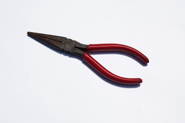 Fototapeta premium Red pliers on a white background